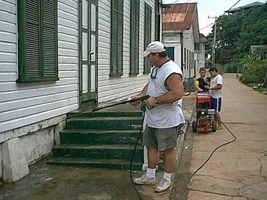 Dexter attempts to pressure wash the church